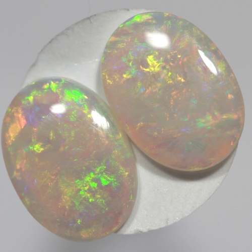 SOLID SEMI BLACK OPALS Matching pair, bright green and orange